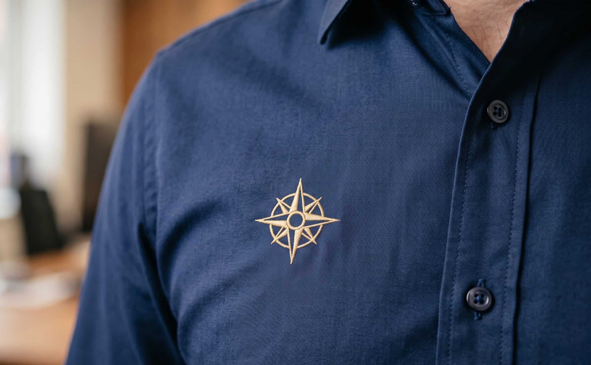 Small embroidered logo on a business shirt chest